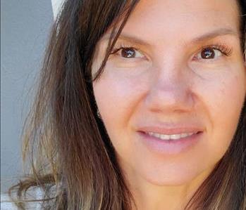 head shot of female employee's face smiling