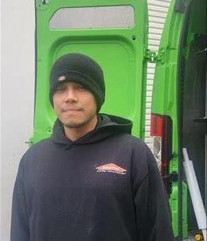 Photo of male SERVPRO employee wearing company hat and shirt