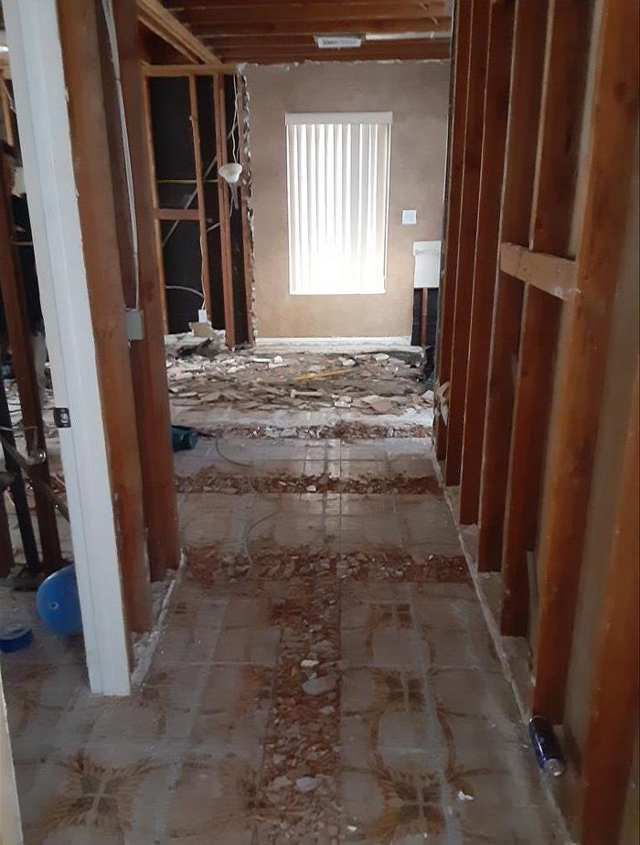 demolished hall in a water damaged home