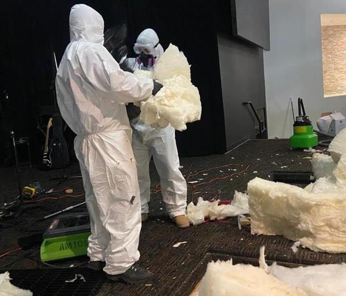 insulation fallen from water damaged ceiling